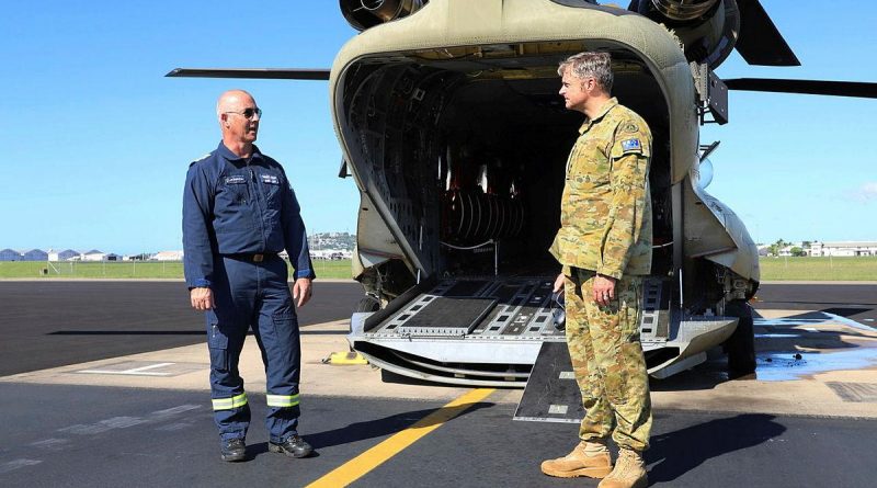 Former Army technician Greg Maiden, left, is congratulated by Commanding Officer 5th Aviation Regiment Lieutenant Colonel Christopher McDougall after completing 5000 flying hours in the CH-47. Story by Captain Carolyn Barnett. Photo by Private Emily Mann.