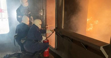 Participants in the Defence Work Experience Program are instructed how to use fire extinguishers in the School of Ship Safety and Survivability fire simulator during a visit to HMAS Cerberus. Story by Alex DeValentin. Photo by Leading Seaman James McDougall.