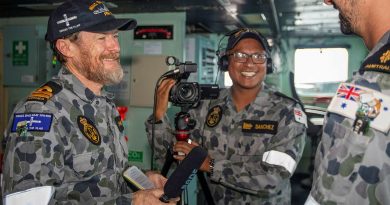 Lieutenant Gary McHugh and Leading Seaman Ernesto Sanchez interview Able Seaman Matthew Hicks on the ship's bridge during a Regional Presence Deployment. Story by Lieutenant Gary McHugh. Photo by Leading Seaman Ernesto Sanchez.