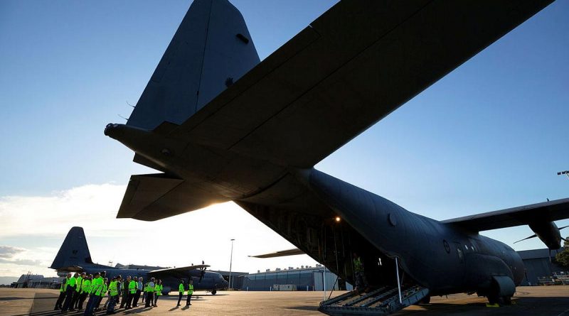 Quickstep Aerospace Services employees are given a tour of a No. 37 Squadron C-130J Hercules during a visit to RAAF Base Richmond. Story by Eamon Hamilton. Photo by Corporal David Said.