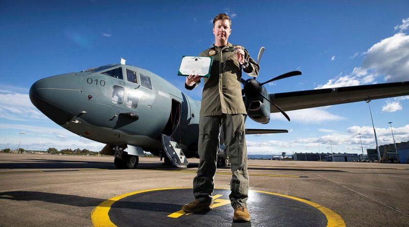 Air Mobility Training and Development Unit loadmaster Sergeant Robert McGavock with a US Army Achievement Medal presented to him by the United States Army Special Operations Command. Story by Eamon Hamilton. Photo by Corporal David Said.