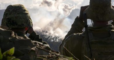 An Australian Army soldier and a Japan Ground Self Defense Force soldier conduct bilateral forward observer training during 2019 Exercise Southern Jackaroo at Shoalwater Bay. Photo by Corporal Tristan Kennedy.