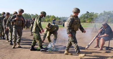 Australian and Japanese soldiers and US Marines participate in a smoking ceremony Robertson Barracks to kick-start Exercise Southern Jackaroo. Photo by Barrie Collins, for CONTACT.