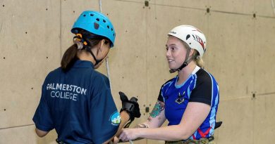 Signaller Catherine Welsh, right, from the 1st Combat Signal Regiment, with a young Indigenous woman from the Stars Foundation after an abseiling run at Robertson Barracks. Story by Captain Peter March. Photo by Corporal Rodrigo Villablanca.