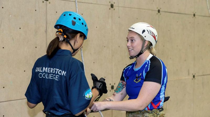 Signaller Catherine Welsh, right, from the 1st Combat Signal Regiment, with a young Indigenous woman from the Stars Foundation after an abseiling run at Robertson Barracks. Story by Captain Peter March. Photo by Corporal Rodrigo Villablanca.