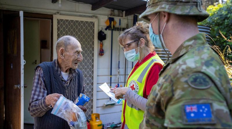 Mount Dandenong resident Jim Henderson has a welfare check by Australian Red Cross representative Kerry Macfarlane and Corporal Paul Summerbell after the recent storm. Story by Captain Martin Hadley. Photo by Corporal David Cotton.