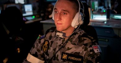 Leading Seaman Combat Systems Operator Joshua Fordham operates an aircraft control console in the Operations Room of HMAS Ballarat during the ship's Regional Presence Deployment. Story by Lieutenant Gary McHugh. Photo by Leading Seaman Ernesto Sanchez.