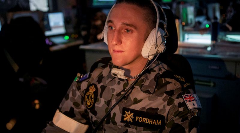 Leading Seaman Combat Systems Operator Joshua Fordham operates an aircraft control console in the Operations Room of HMAS Ballarat during the ship's Regional Presence Deployment. Story by Lieutenant Gary McHugh. Photo by Leading Seaman Ernesto Sanchez.