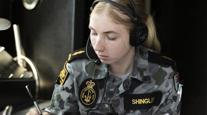 Able Seaman Communications and Information Systems Tamara Shingles communicates with ships in company, as HMAS Brisbane conducts replenishment at sea approach off the coast of Queensland, during Exercise Talisman Sabre 2021. Story by Lieutenant Sarah Rohweder. Photo by LSIS Daniel Goodman.