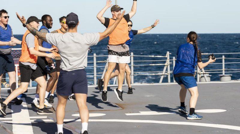 Seaman Boatswain’s Mate Melita Tennant prepares to throw the ball during a Bin Ball competition held on-board HMAS Brisbane, off the coast of Queensland for Exercise Talisman Sabre 2021. Story by Lieutenant Sarah Rohweder. Photo by Leading Seaman Daniel Goodman.