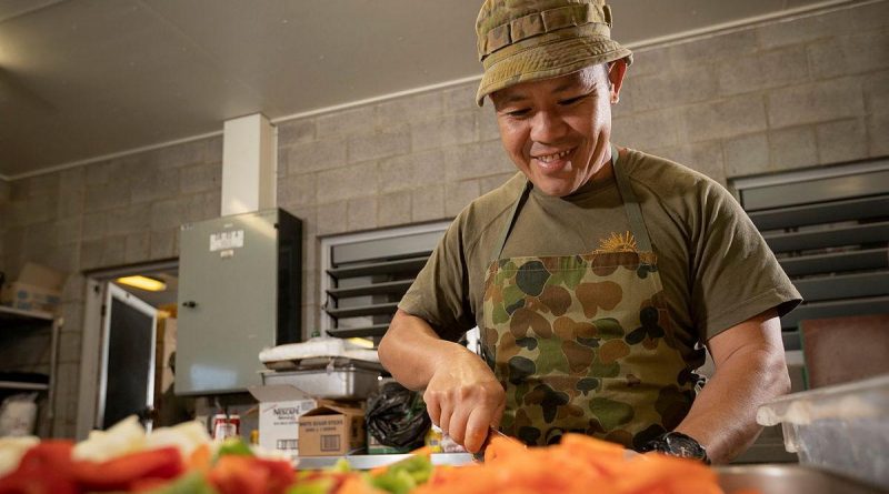 Private Supachai Kladpin, of the 10th Force Support Battalion, cooks meals in the Camp Growl kitchen in the Shoalwater Bay Training Area, Queensland, during Exercise Talisman Sabre. Story by Lieutenant Max Logan. Photo by Corporal Madhur Chitnis.