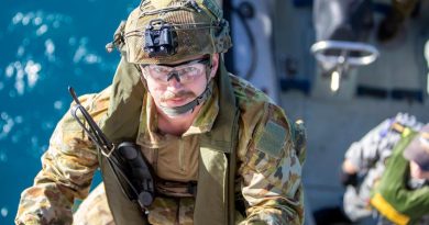 An Australian Army soldier climbs aboard HMAS Ballarat from a Rigid-Hulled Inflatable Boat during joint pre-landing force training, off the coast of Queensland, during Exercise Talisman Sabre 2021. Story by Lieutenant Commander Ryan Zerbe. Photo by LSIS Ernesto Sanchez.