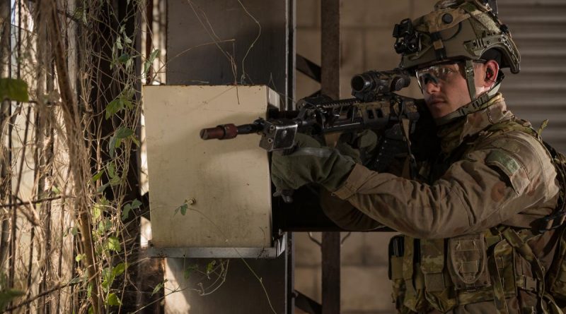Australian Army soldier Private Luke Armstrong from the 2nd Battalion, Royal Australian Regiment, provides window security during a role playing scenario held at Bowen in Queensland, during Exercise Talisman Sabre 2021. Story by Private Jacob Joseph. Photo by Corporal Madhur Chitnis.