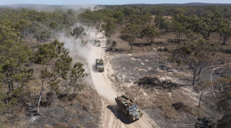 Australian Army Bushmaster's from Battlegroup Coral, conduct a forward passage of lines at the Townsville Field Training Area in Queensland, during Exercise Talisman Sabre 2021. Story by Captain Diana Jennings. Photo by Corporal Brandon Grey.