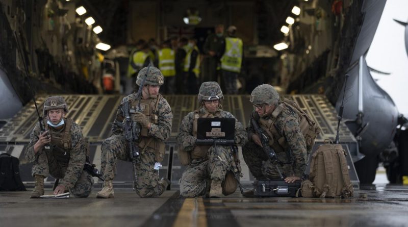 United States Marines conduct a simulated wartime airfield scenario at the rear of a Royal Australian Air Force No. 36 Squadron C-17A Globemaster III aircraft at RAAF Base Amberley, QLD, during Exercise Talisman Sabre 2021. Story by Flight Lieutenant Clarice Hurren. Photo by Corporal Jesse Kane.