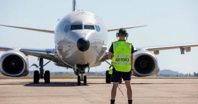 A Royal Australian Air Force Avionics Technician guides a P-8A Poseidon aircraft into position, as it prepares to depart RAAF Base Townsville in Queensland. Story by Flight Lieutenant Chloe Stevenson. Photo by Leading Aircraftwoman Emma Schwenke.