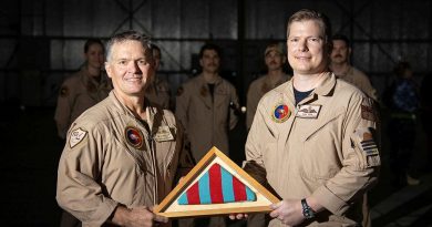The Commander's Pennant for Air Task Group 630 is passed from outgoing commander Wing Commander Ric Peapell, left, to the incoming commander Wing Commander Alexander Cave. Photo by Glen McCarthy.