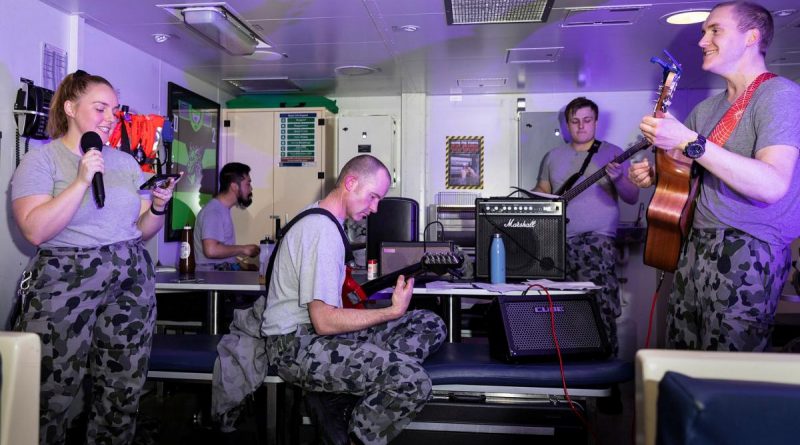 HMAS Brisbane’s band, made up of members of the crew, play their first gig together in front of a live audience in the junior sailors' café off the coast of Queensland during Exercise Talisman Sabre. Story and photo by Leading Seaman Daniel Goodman.