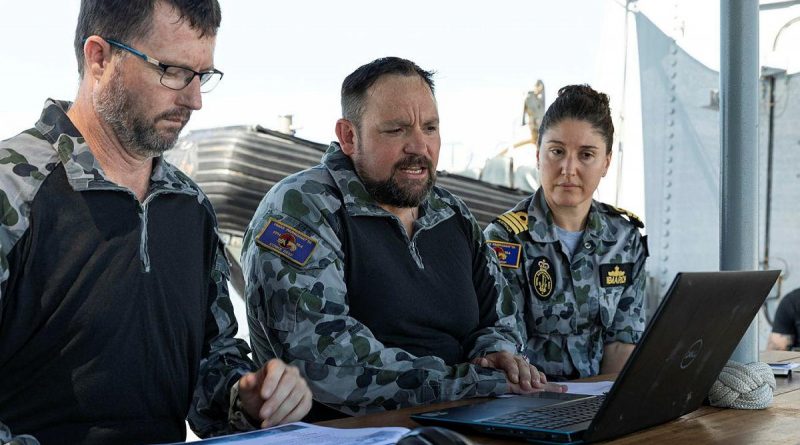 HMAS Parramatta's boarding party officer Lieutenant Daniel McMillan, left, Chief Petty Officer John Hogan and Commanding Officer Commander Anita Nemarich meet virtually with personnel from the Royal Brunei Navy. Story and photo by Leading Seaman Jarrod Mulvihill.