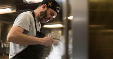 Commanding Officer HMAS Brisbane Commander Aaron Cox, cooks 'midnighters' for his crew in the galley, during Exercise Talisman Sabre. Story and photo by Leading Seaman Daniel Goodman.