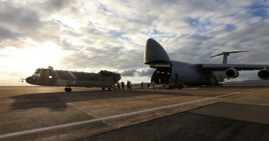 A new CH-47F Chinook heavy-lift helicopter is unloaded from a United Stated C-5 Galaxy at RAAF Base Townsville, Queensland. Photo by Trooper Lisa Sherman.