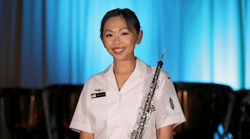 Able Seaman Donna Chung with her oboe. Story by Leading Seaman Jonathan Rendell. Photo by Petty Officer Nina Fogliani.