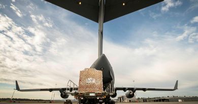 Humanitarian aid equipment is loaded into a No. 36 Squadron C-17A Globemaster III aircraft bound for Fiji. Story by Lieutenant Gordon Carr-Gregg. Photo by Sergeant Ben Dempster.