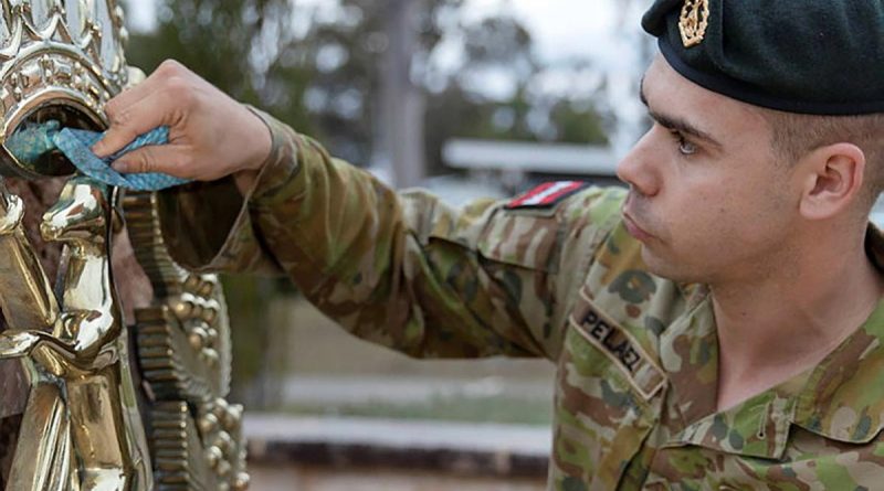 Corporal David-Jose Pelaez, a section commander from the School of Infantry, cleans the Skippy Badge at Depot Company headquarters, Singleton. Story and photo by Private Jacob Joseph.