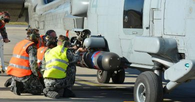 No. 816 Squadron Flight 7 maintenance team re-arms MH-60R helicopter Tiger 14 with a torpedo during the anti-submarine warfare phase of Exercise Tigerfish. Story by Lieutenant Thomas Kennedy.