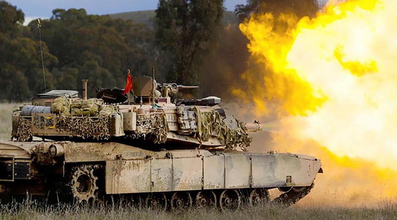 An Australian Army M1A1 Abrams main battle tank fires its main armament during live-fire training for Exercise Gauntlet Strike at Puckapunyal Military Training Area. Photo by Corporal Robert Whitmore.