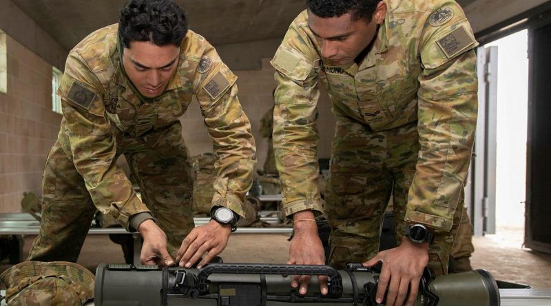 Corporal Steve Tonga, left, and Corporal Paul Tuinanunu, from the 3rd Battalion, Royal Australian Regiment, inspect the Carl Gustaf 84mm Mk4 recoilless rifle after a qualification shoot at the School of Infantry, Singleton. Story and photo by Private Jacob Joseph.