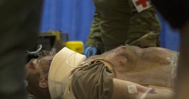 Australian Army medics with the 2nd General Health Battalion, stationed at Gallipoli Barracks in Enoggera, Queensland, simulate injury assessment and resuscitation procedures on a mass casualty exercise during Exercise Talisman Sabre 2019 at Williamson Airfield, Shoalwater. Photo by US Marine Corps Lance Corporal Kealii De Los Santos.