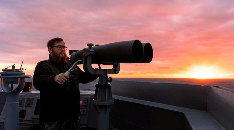 Able Seaman Boatswain’s Mate James Anson keeps watch from the bridge wing as HMAS Brisbane sails off the coast of Queensland during Exercise Talisman Sabre. Story by Lieutenant Sarah Rohweder. Photo by Leading Seaman Daniel Goodman.