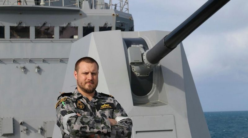 Weapons Electrical Engineering Officer Lieutenant Nick Adriaanse stands on the forecastle of HMAS Brisbane while sailing off the east coast of Queensland. Story by Lieutenant Sarah Rohweder.
