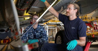 Aircraft fitter Aircraftman Blake Schober, from No.11 Squadron, left, and Airbus maintenance team member Daiman Gordon inspect the fuselage of a P-8A Poseidon at RAAF Base Edinburgh. Story by Bettina Mears. Photo by Leading Aircraftman Sam Price.