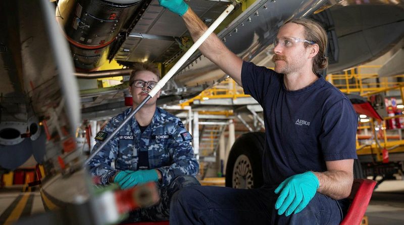 Aircraft fitter Aircraftman Blake Schober, from No.11 Squadron, left, and Airbus maintenance team member Daiman Gordon inspect the fuselage of a P-8A Poseidon at RAAF Base Edinburgh. Story by Bettina Mears. Photo by Leading Aircraftman Sam Price.