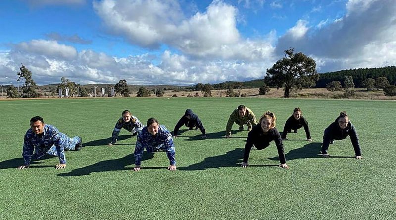 Headquarters Joint Operations Command and Spotless personnel participate in the 2021 Push For Better push-up challenge on the Walter Roy Hyles Field at HQJOC Bungendore, NSW. Story by Sarah Collins.