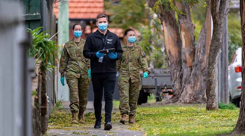 Army Privates Kate Larby and Maddison Lillie, and Victorian Department of Health Authorised Officer Daniel Green on patrol as part of a COVID-19 Household Engagement Program to support the Victorian State government’s response to the COVID-19 Pandemic. Photo by Private Michael Currie.