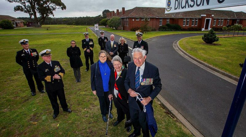 Commodore Jim Dickson (retd) unveils the sign for the new road named in his honour at HMAS Cerberus, joined by members of his family and senior Cerberus personnel. Story by Lieutenant Commander Helen Ward. Photo by Petty Officer James Whittle.