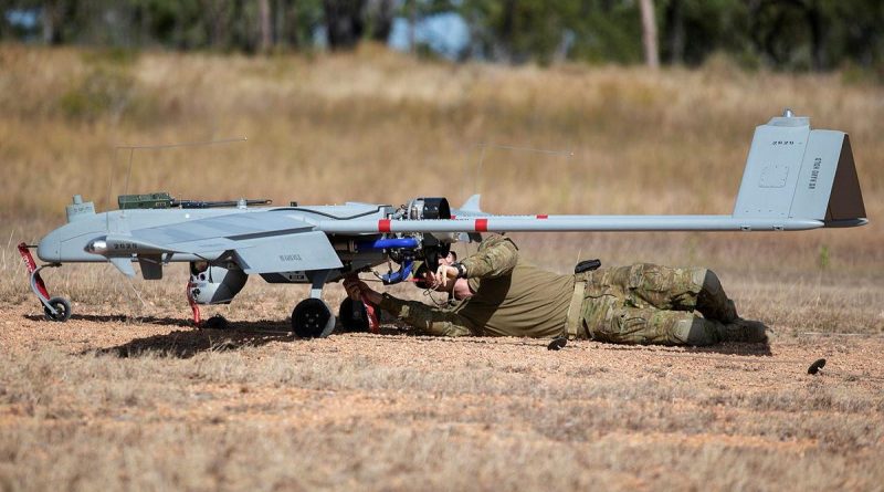 Lieutenant Dallin Stirling attaches post-flight safety tags to a Shadow 200 during Exercise Dragon Sprint at the Townsville Field Training Area. Story and photo by Petty Office Lee-Anne Cooper.