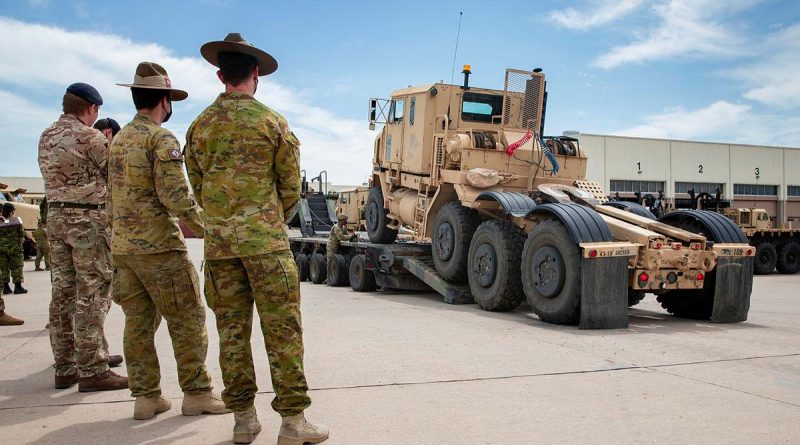 Soldiers from the US Army's 14th Sustainment Brigade demonstrate their vehicle-recovery capabilities to soldiers from the Australian, British and Canadian armies during the Joint Warfighting Assessment. Story by Captain Taylor Lynch. Photo by Corporal Nicole Dorrett.