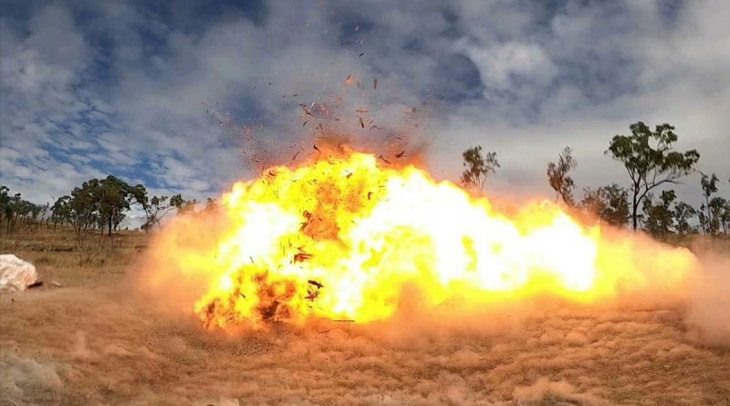 Setting off the charge, a wooden pallet explodes during demolition training on Exercise Phoenix Strike, held in Townsville, Queensland. Story by Captain Lily Charles. Photo by Corporal Brodie Cross.