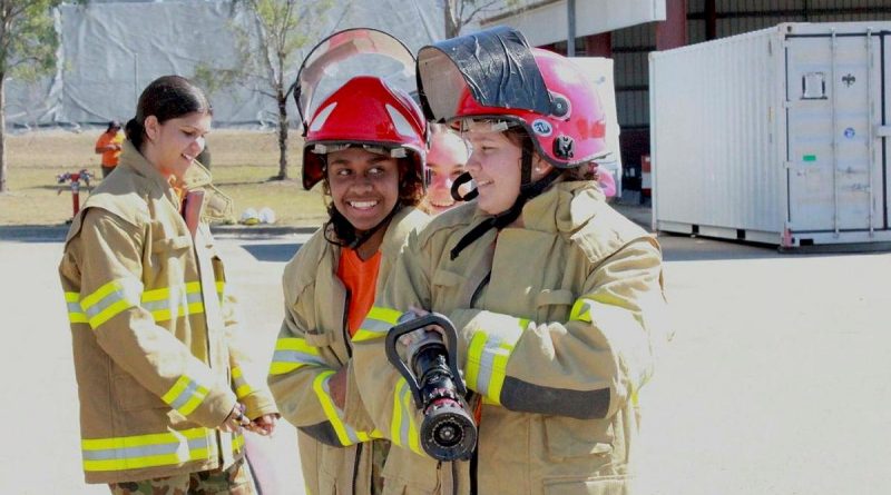 Khalia, Anne and Brieanna, from Stars Foundation, participate in a mock firefighting drill with 9 Petroleum Platoon, Lavarack Barracks as part of a Defence Work Experience Day. Story by Captain Annie Richardson. Photo by Corporal Ashely Hetherington.