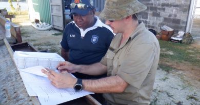 SIG Wayne Tranter provides a site brief to Papua New Guinea Navy Able Seaman Basil as part of the Communications Infrastructure Upgrade on Manus Island. Story by Leading Seaman Kylie Jagiello.