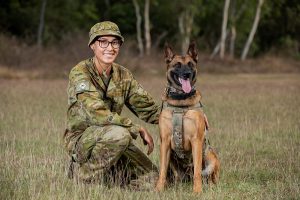 Australian Army Private Beata Wawrzynowicz and Military Police Dog Azura from the 1st Military Police Battalion. Photo by Leading Aircraftwoman Emma Schwenke.