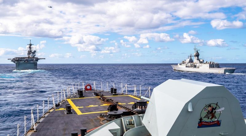 Canadian frigate HMCS Calgary (foreground), in company with USS America (left) and Australian frigate HMAS Parramatta (right) off the coast of QLD, during Exercise Talisman Sabre 21. Story by Lieutenant Sarah Rohweder. Photo by Corporal Lynette Ai Dang.