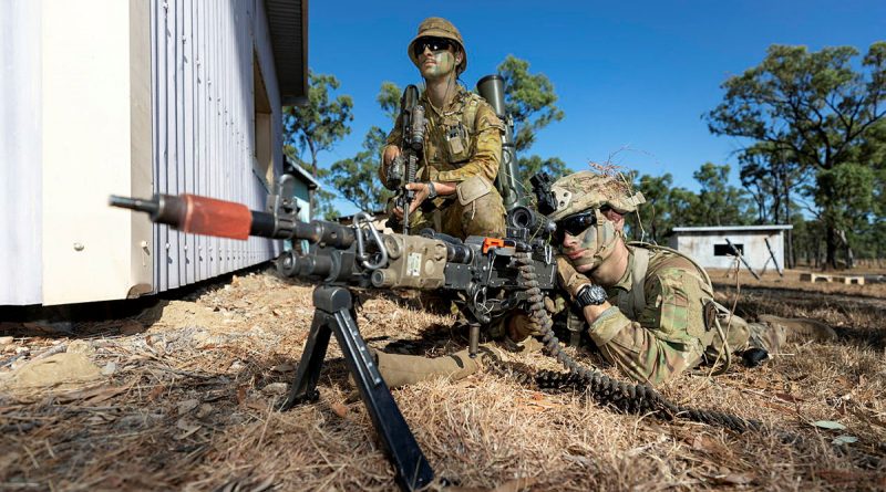 An Australian Army soldier from Battlegroup Coral and a United States Army paratrooper provide security during clearance of an enemy position. Story by Captain Diana Jennings. Photo by Corporal Brandon Grey.