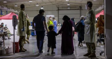 Evacuees enter the evacuee handling centre at Australia’s main operating base in the Middle East, following their evacuation from Kabul, Afghanistan. (This image has been digitally manipulated). Story by Lieutenant Max Logan. Photo by Leading Aircraftwoman Jacqueline Forrester.