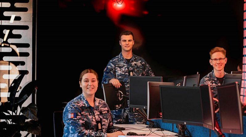 Air Force Officer Cadets Josephine Curtis, left, William Farrell and Elliot Parker, from the Australian Defence Force Academy, are training to become cyber security officers. Story by Flying Officer Lily Lancaster. Photo by Leading Aircraftman Adam Abela.