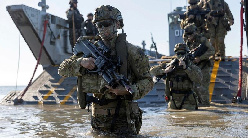 Personnel from the 3rd Battalion Royal Australian Regiment, conduct a beach assault on Forrest Beach, Queensland, during Exercise Talisman Sabre 2021. Story by Private Jacob Joseph. Photo by Leading Aircraftwoman Jacqueline Forrester.